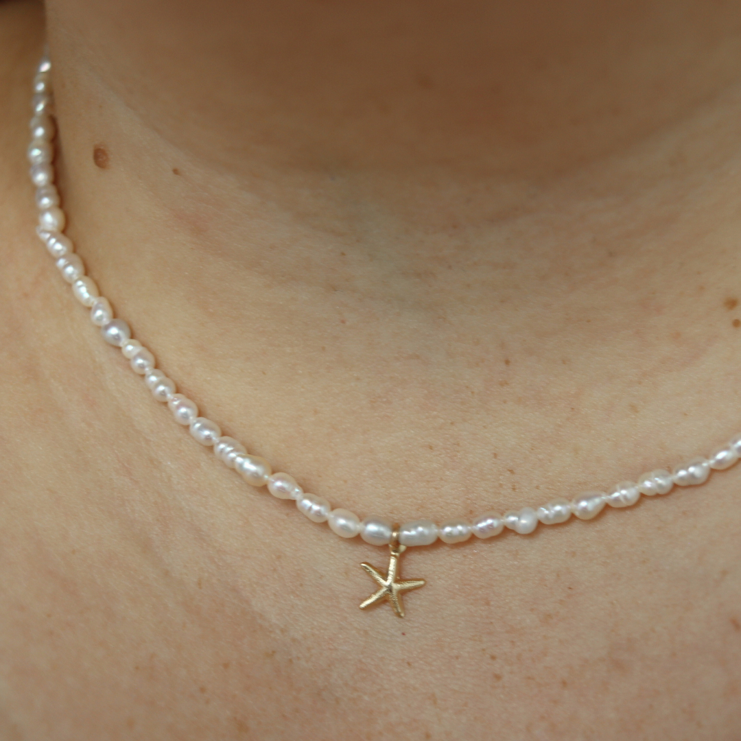 Star Whisper - Tiny Seed Pearls with a Gold Starfish Charm