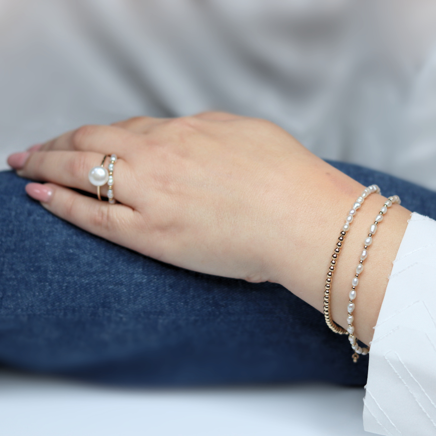 A stunning gold beads and white pearl bracelet, beautifully crafted to enhance any outfit with its refined and classic appeal.