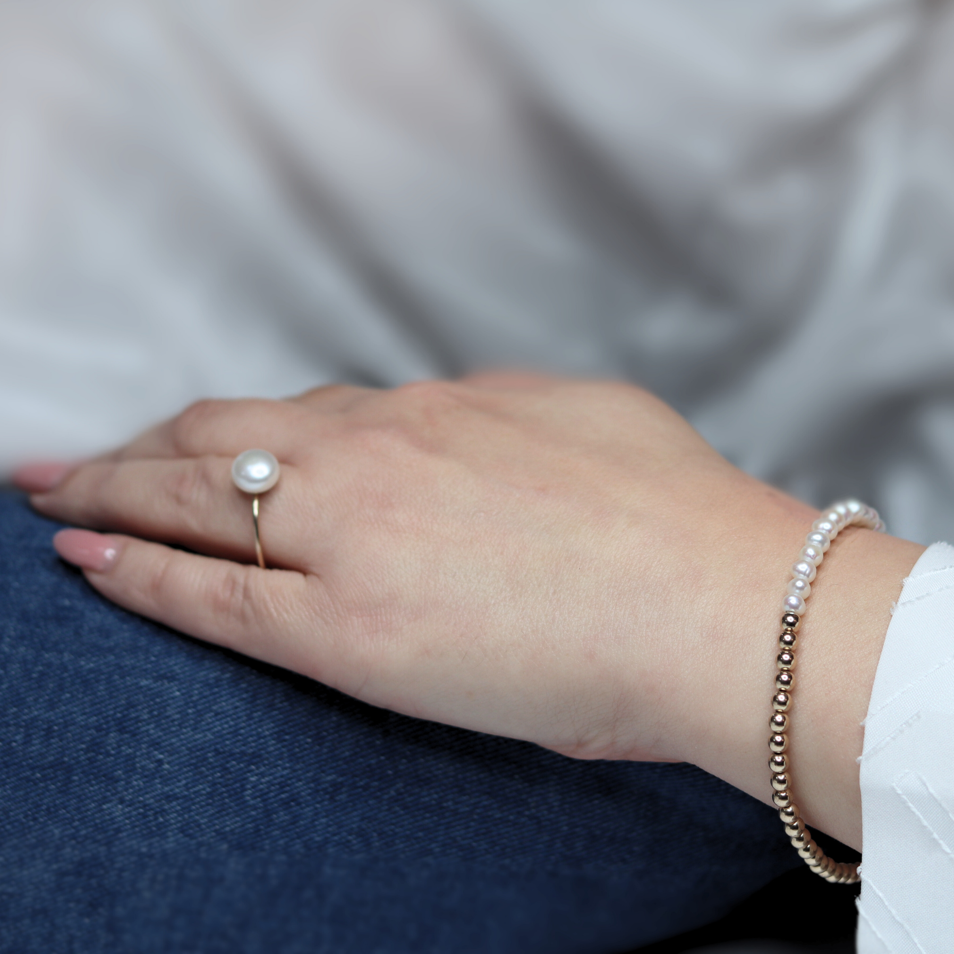 A stunning gold beads and white pearl bracelet, beautifully crafted to enhance any outfit with its refined and classic appeal.