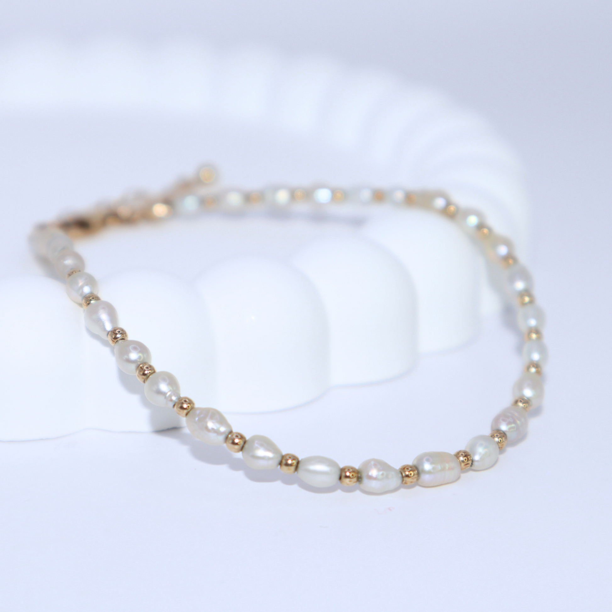 Alternating pearls and beads, crafted with gold filled or sterling silver, we created a versatile piece that adds a touch of glam to any outfit.