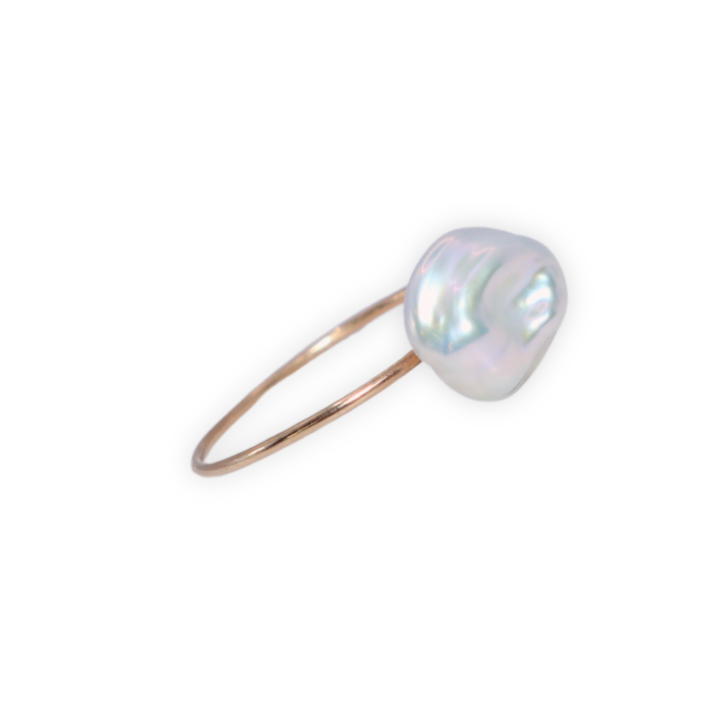 A beautiful baroque pearl gracefully perched on a gleaming gold ring, symbolizing elegance and refined taste.