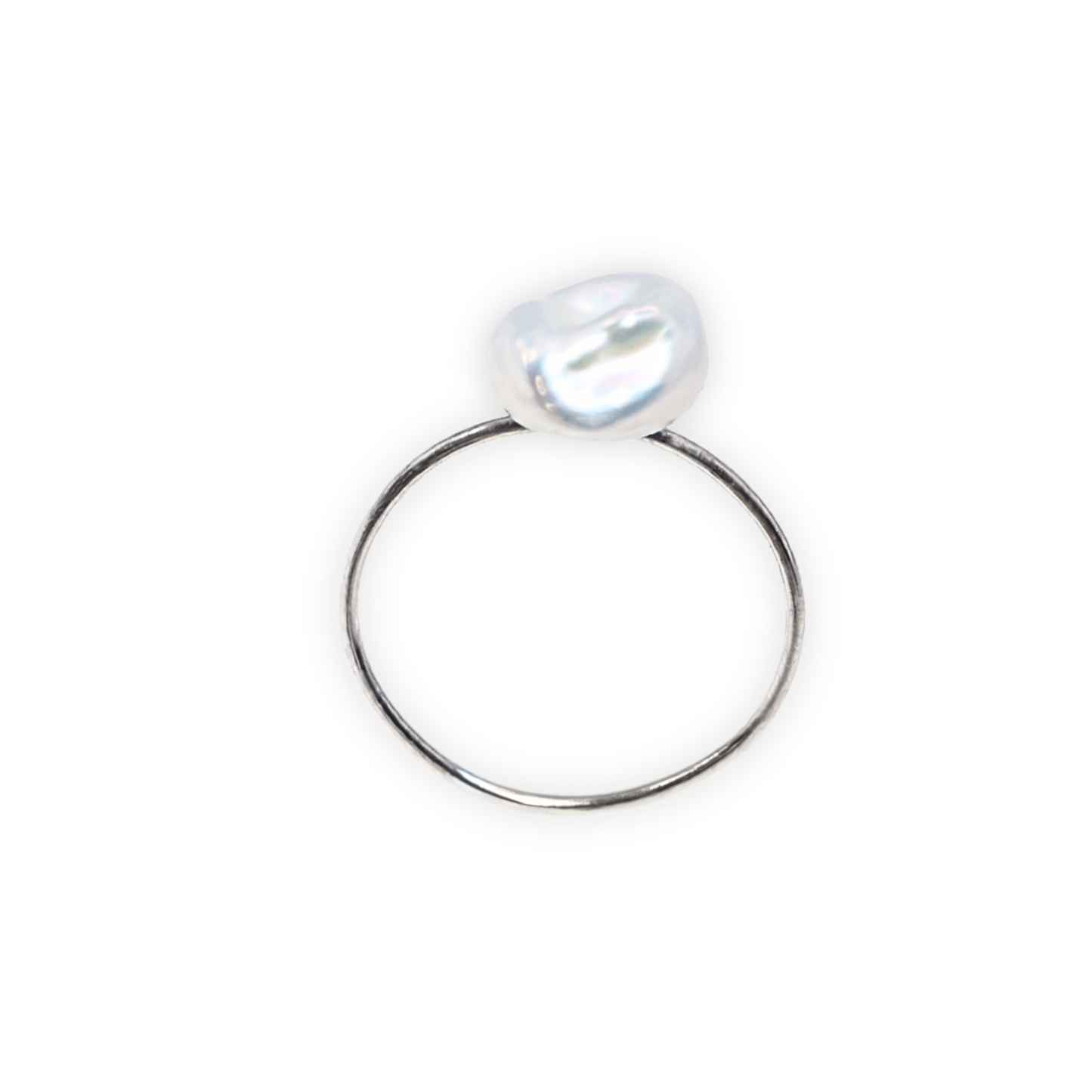 A beautiful baroque pearl gracefully perched on a gleaming silver ring, symbolizing elegance and refined taste.