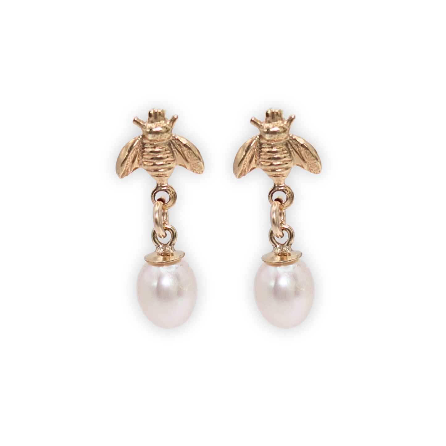 These small teardrop pearls add a touch of elegance to any look, while the playful bee studs bring a fun and unique element.