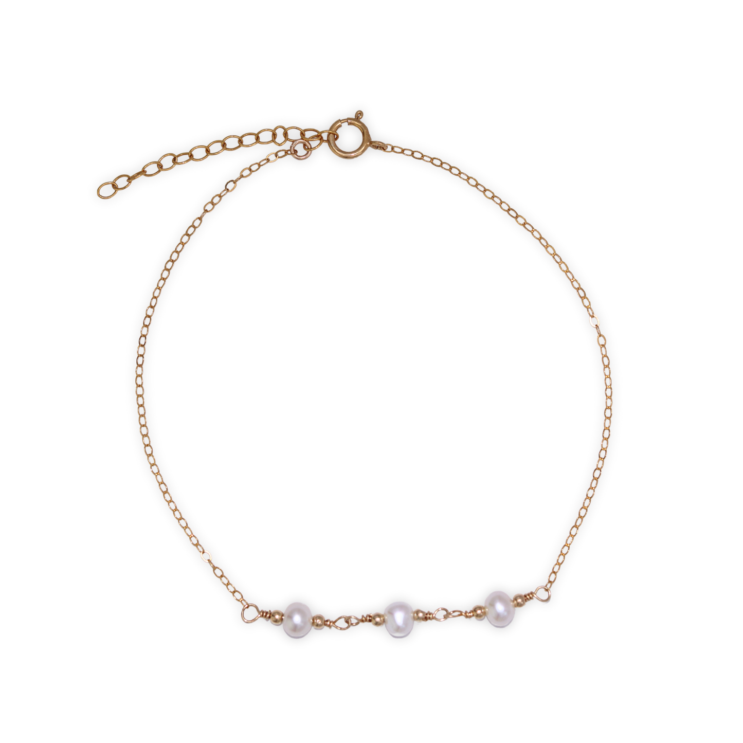 A gold chain bracelet adorned with three elegant pearls surrounded by gold beads, showcasing a blend of luxury and sophistication.