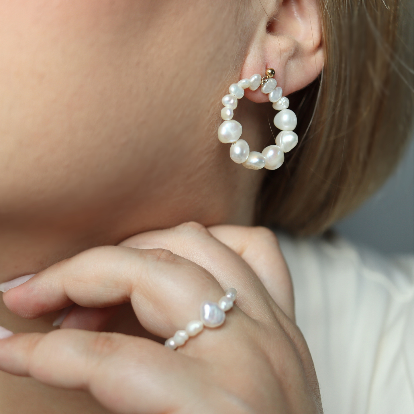 Crafted with a circular style, these earrings feature multi-sized baroque pearls and stud balls for a modern touch.