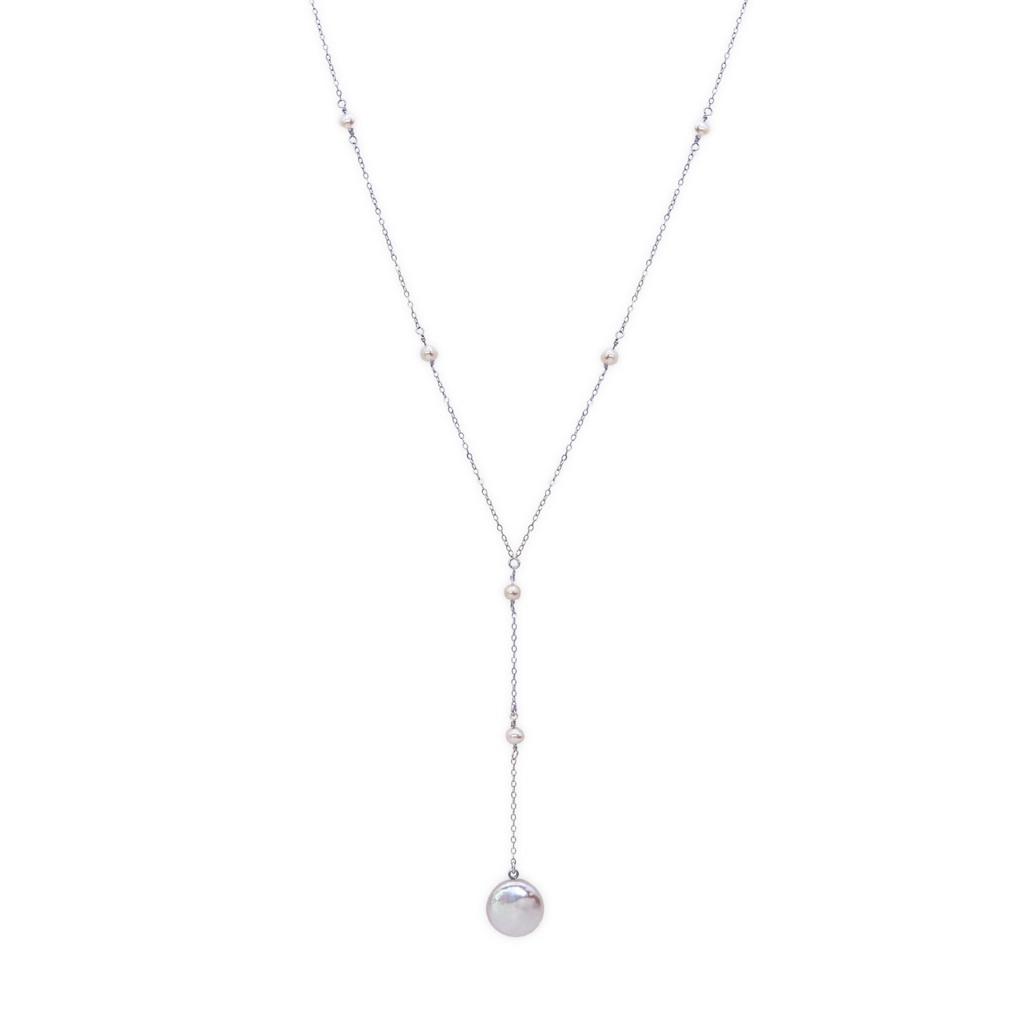 An elegant long necklace adorned with a tiny pearls and a large coin pearl pendant, showcasing timeless beauty and luxury, perfect for a deeper cleavage.