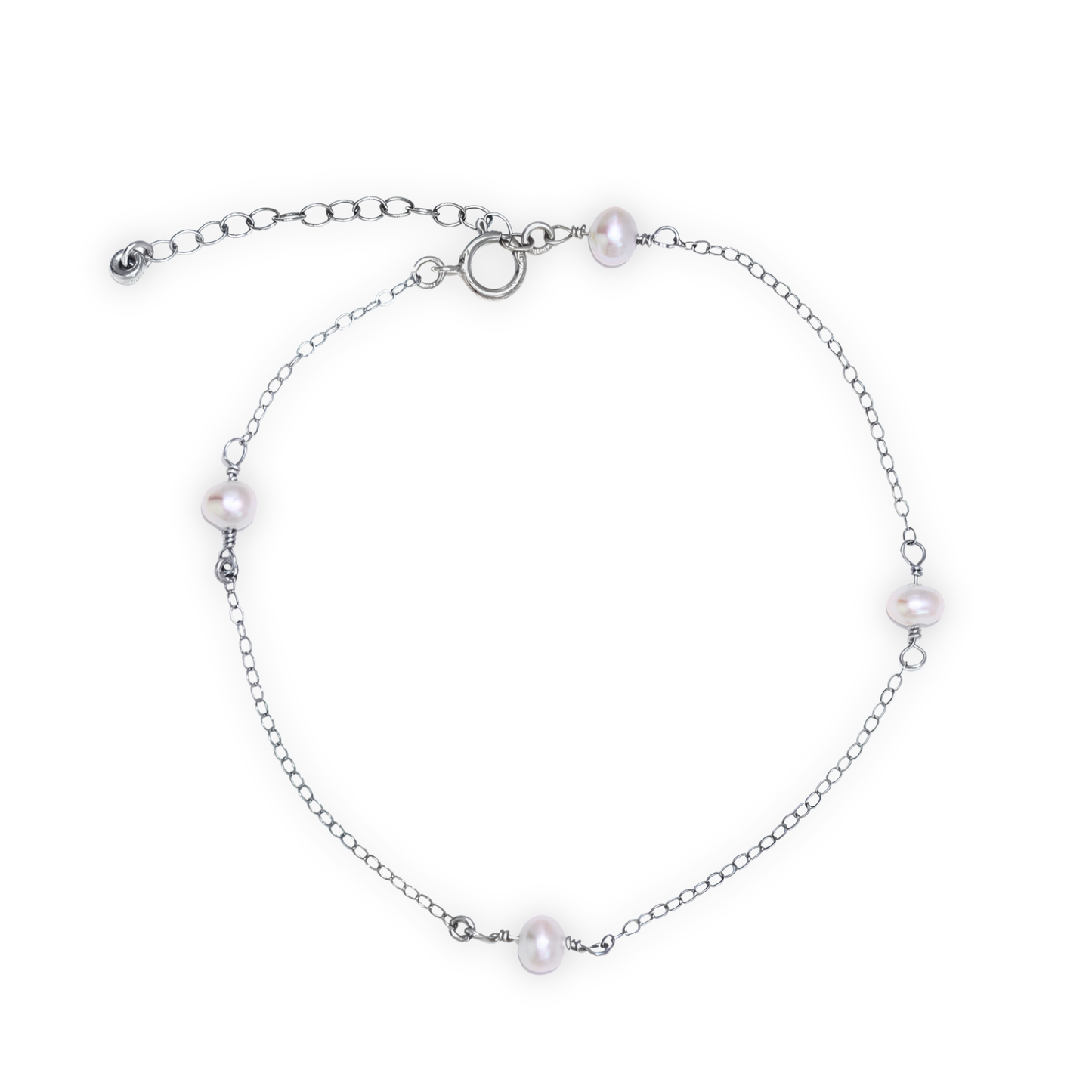 A silver chain bracelet adorned with four elegant pearls, showcasing a blend of luxury and sophistication.
