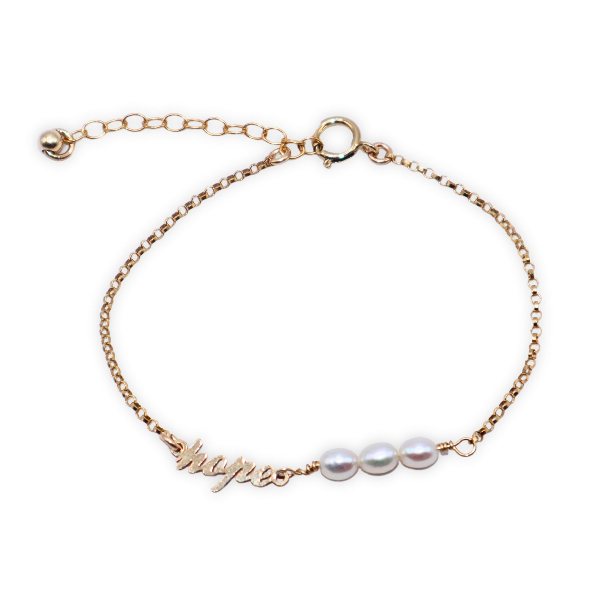 a dainty chain adorned with three small rice pearls and the word "hope".