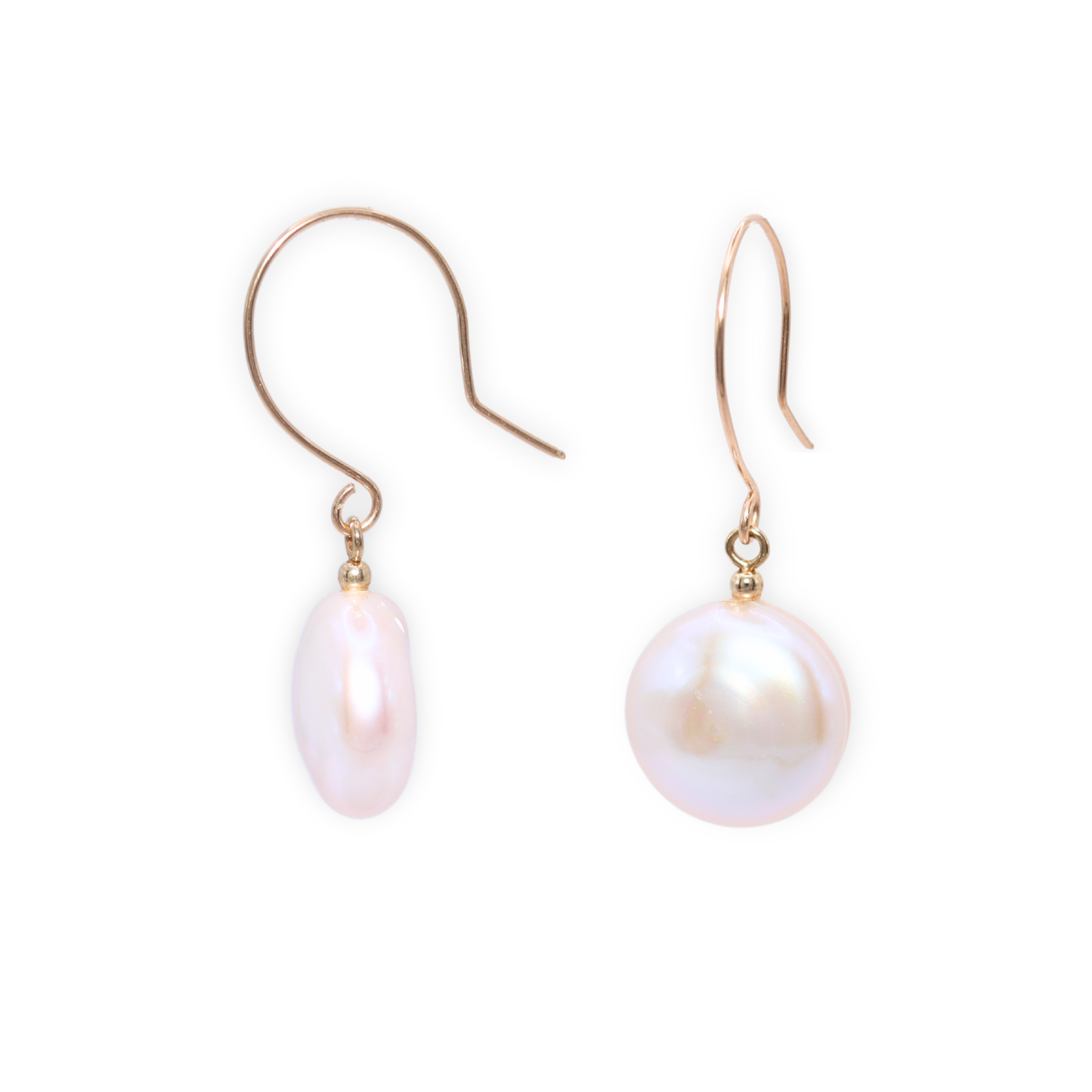 These exquisite earrings feature lustrous coin pearls delicately suspended from round hook earrings.