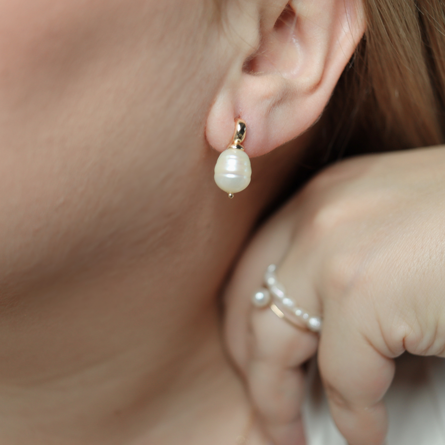 Each stud features a unique, irregularly-shaped rice pearl, adding a touch of sophistication and luxury to your look.