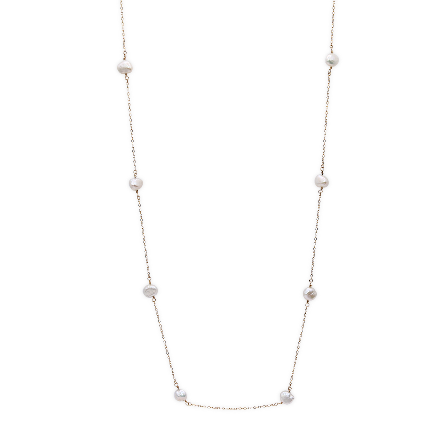 A long necklace featuring an elegant arrangement of ivory baroque pearls, showcasing a sophisticated design.
