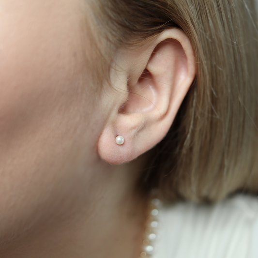 3mm pearl studs that add a touch of sophistication to any outfit