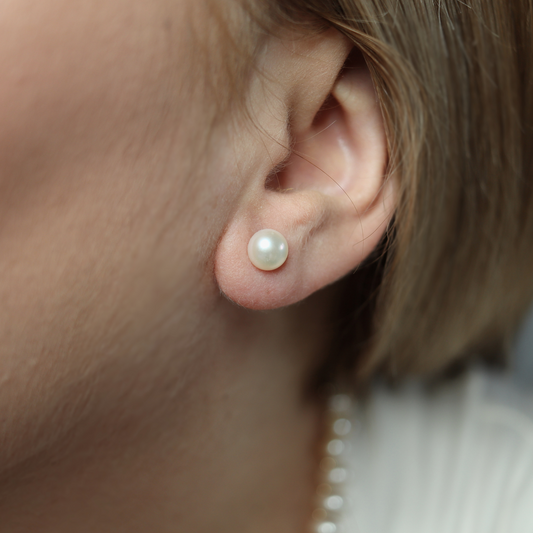 7mm pearl studs that add a touch of sophistication to any outfit