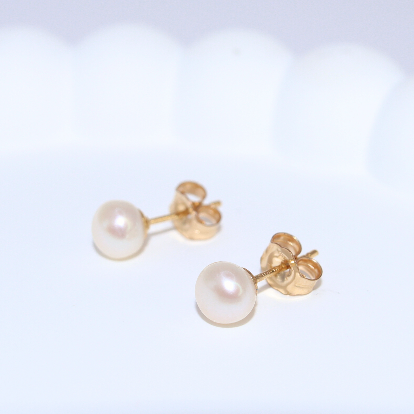 7mm pearl studs that add a touch of sophistication to any outfit