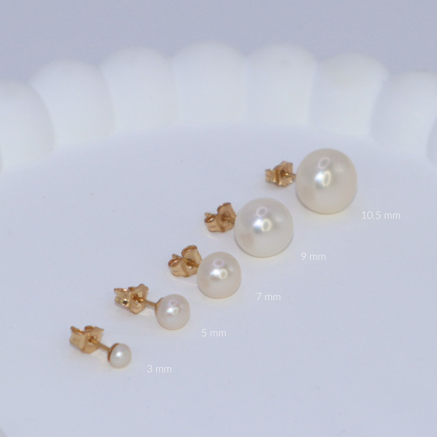 3mm pearl studs that add a touch of sophistication to any outfit