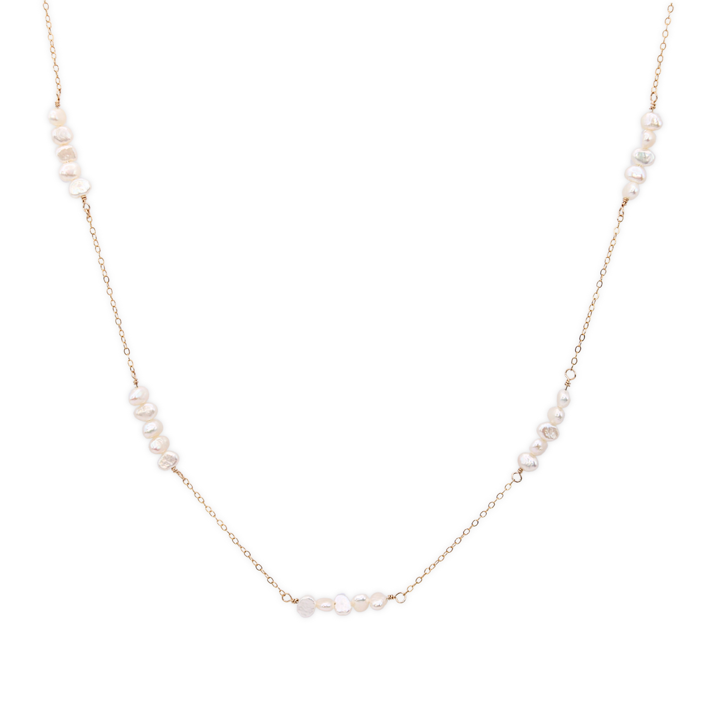 A delicate chain necklace featuring clusters of four small, lustrous pearls elegantly arranged along its length.