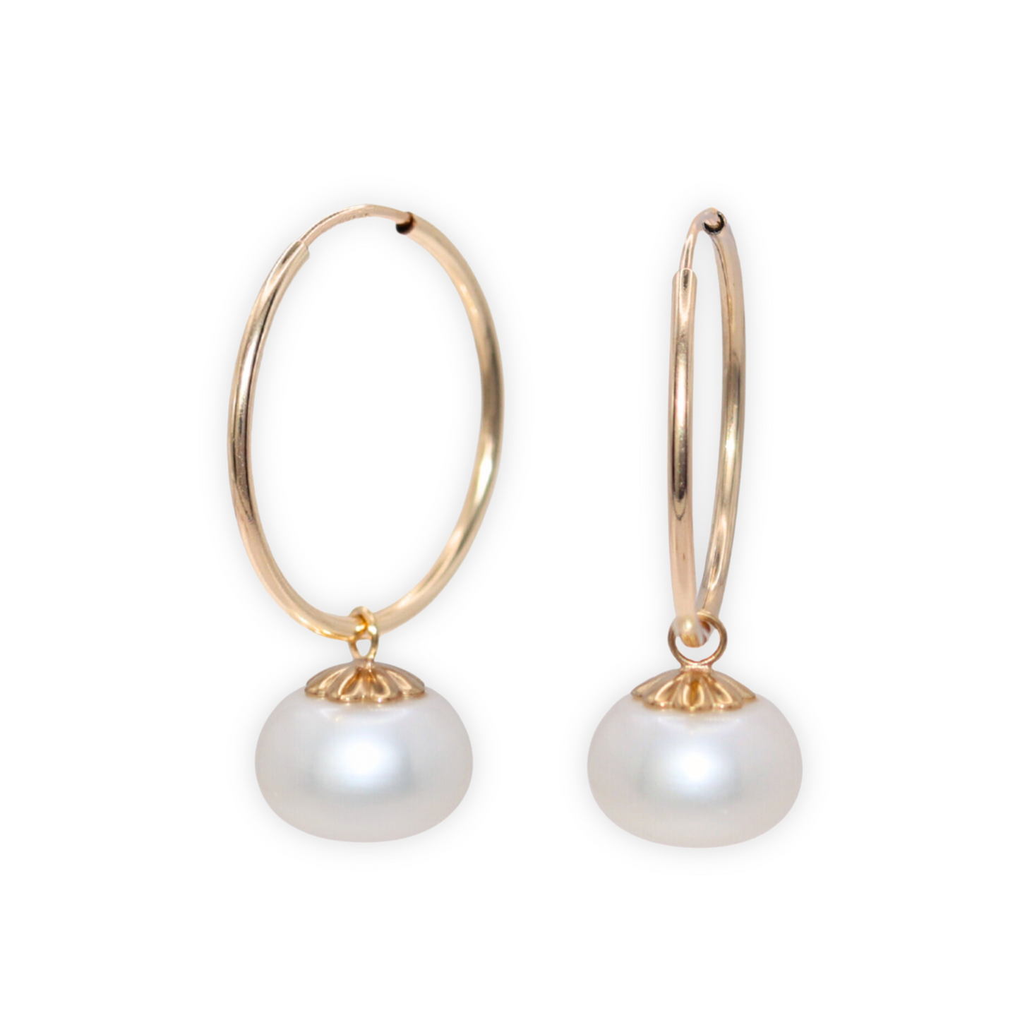 Elevate your look with our Zoe Pearl Hoop Earrings, featuring a solitaire pearl delicately perched on a sleek hoop