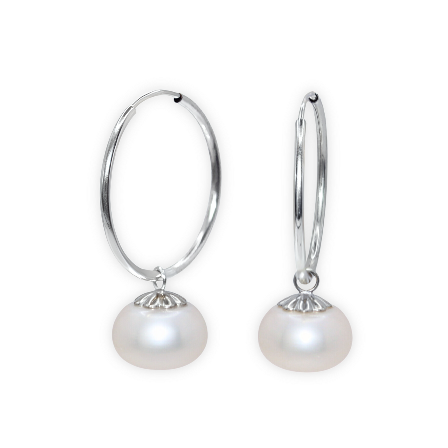 Elevate your look with our Zoe Pearl Hoop Earrings, featuring a solitaire pearl delicately perched on a sleek hoop