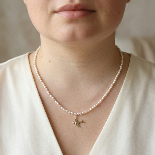 Skyflight - Baroque Pearls with a Graceful Flying Bird Charm
