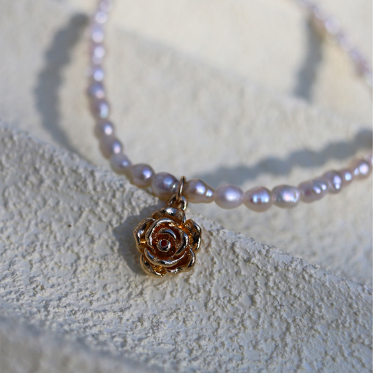 Rose Dew - Seed Baroque Pearls with a Delicate Rose Charm