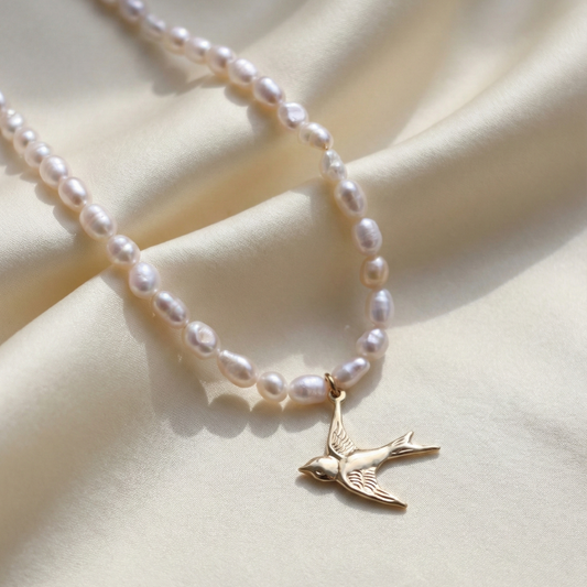 Skyflight - Baroque Pearls with a Graceful Flying Bird Charm