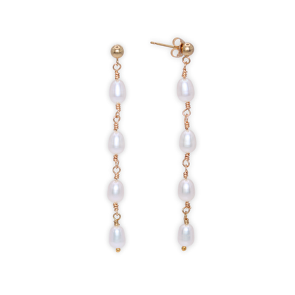Elegant gold and four ivory pearl drop earrings, exuding sophistication and timeless beauty, perfect for any luxurious occasion.