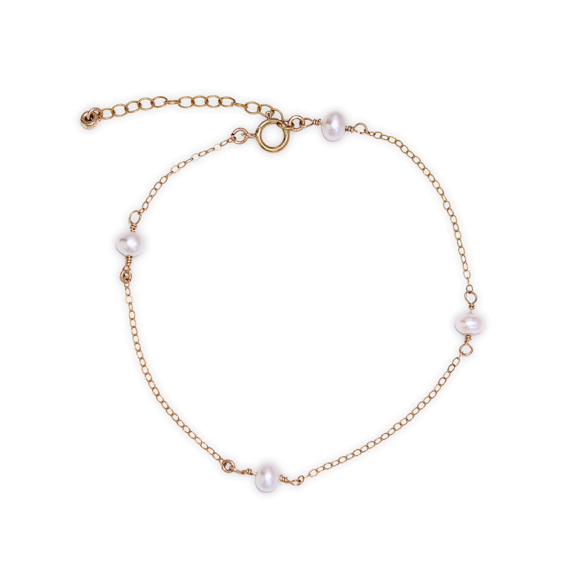 A gold chain bracelet adorned with four elegant pearls, showcasing a blend of luxury and sophistication.
