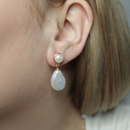 Featuring pearl studs and flat teardrop dangles, these earrings exude elegance and sophistication.