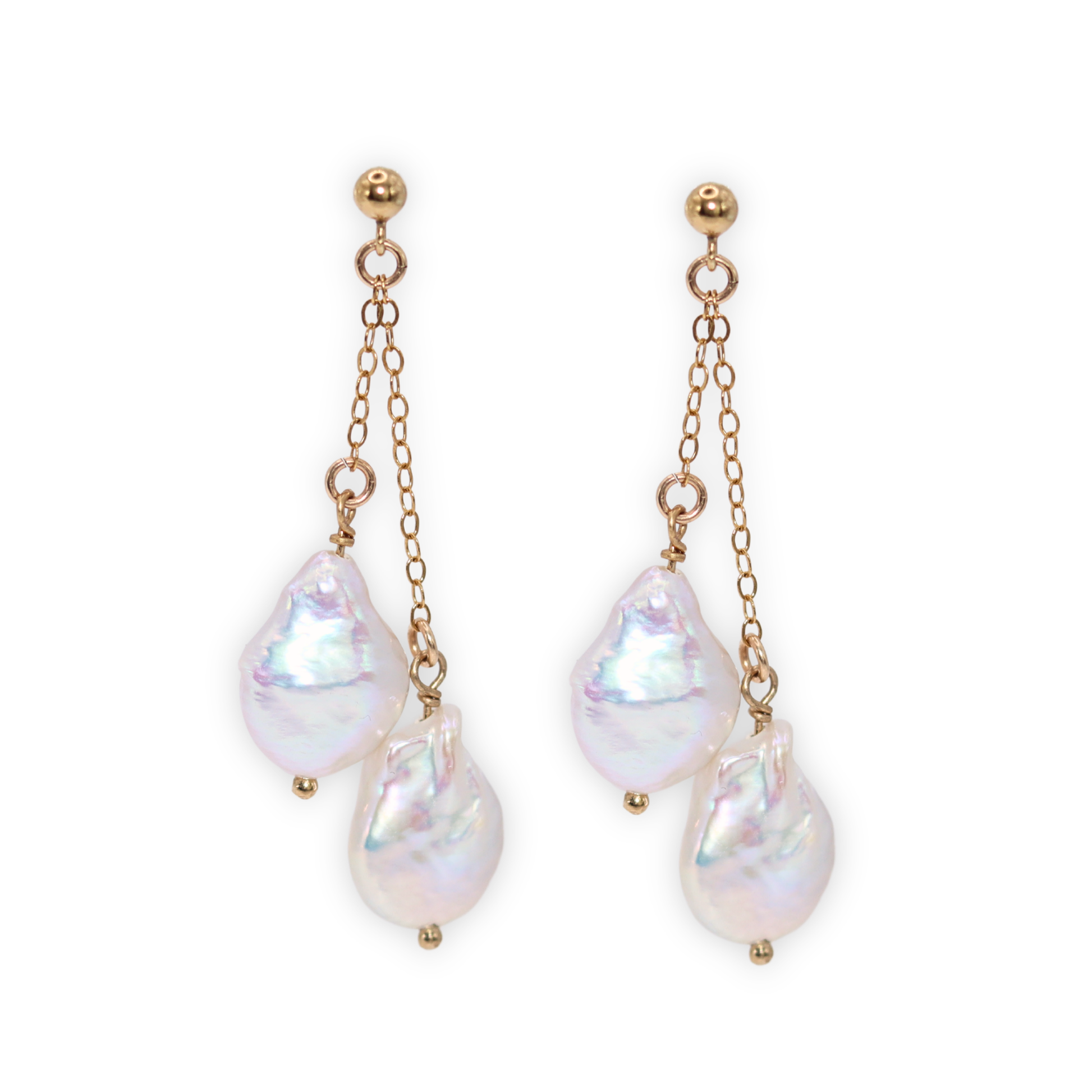 Featuring stunning baroque pearls dangling on dainty chains, these earrings exude elegance and luxury.