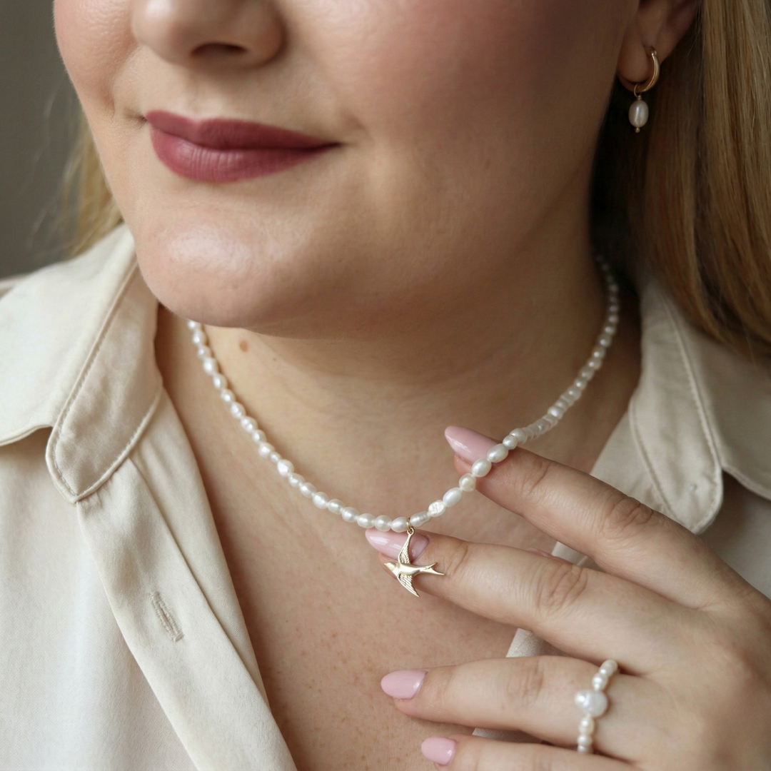 Skyflight - Baroque Pearls with a Graceful Flying Bird Charm